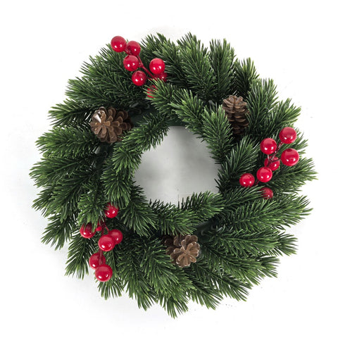 Christmas wreath with green pine needles, red berries, and brown pinecones on a white background