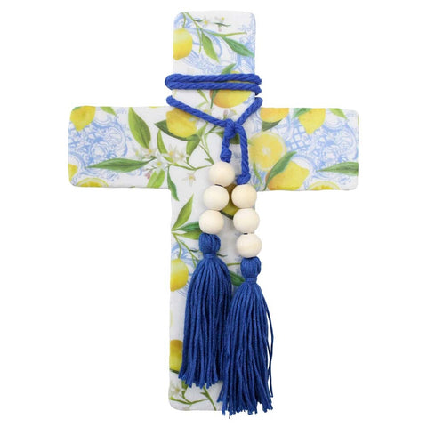 Decorative item with blue tassels and beads on a floral background