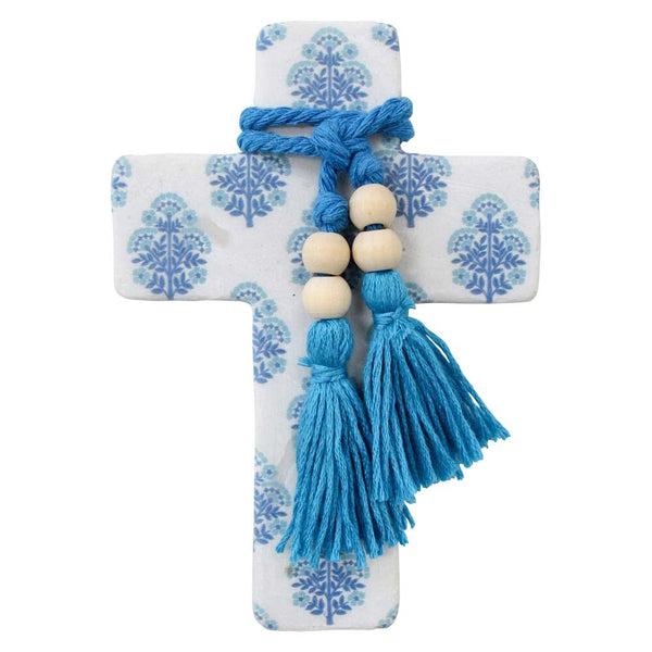 Decorative cross with blue tassels and beads on a white background
