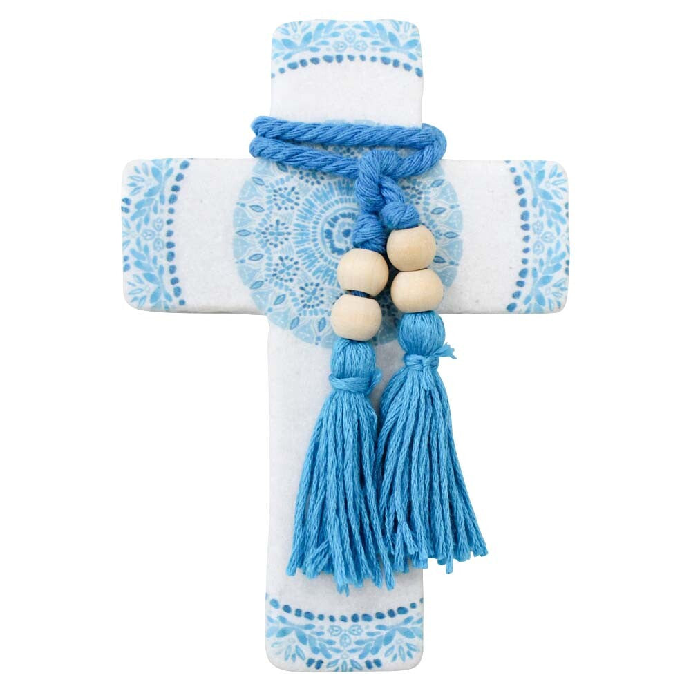 Decorative cross with blue patterns and tassels on a white background